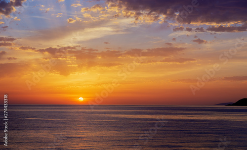 Bright sunrise over the sea. © Alexander