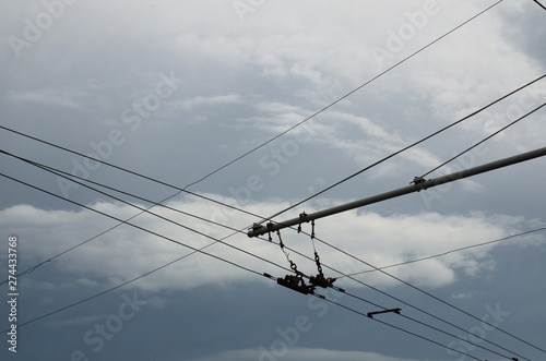 Trolley bus street wire line with clouds on background