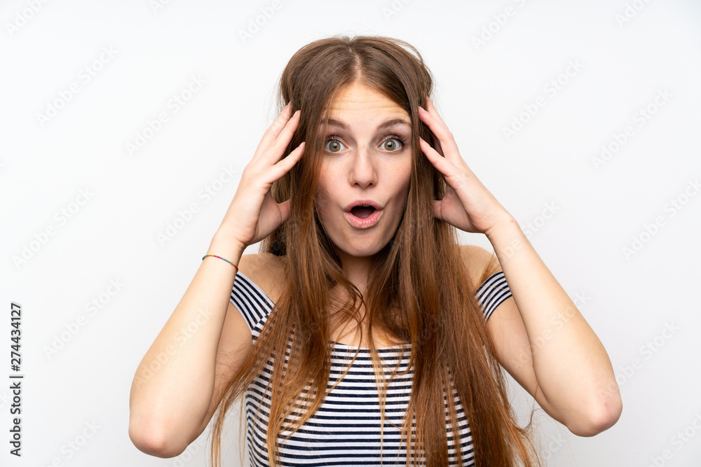 Young woman with long hair over isolated white wall with surprise expression Young woman with long hair over isolated white wall with surprise expression