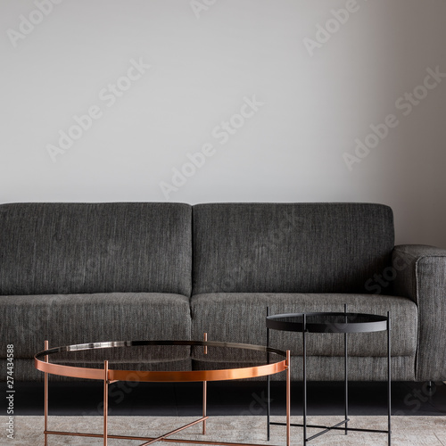 Gray sofa and metal coffee tables