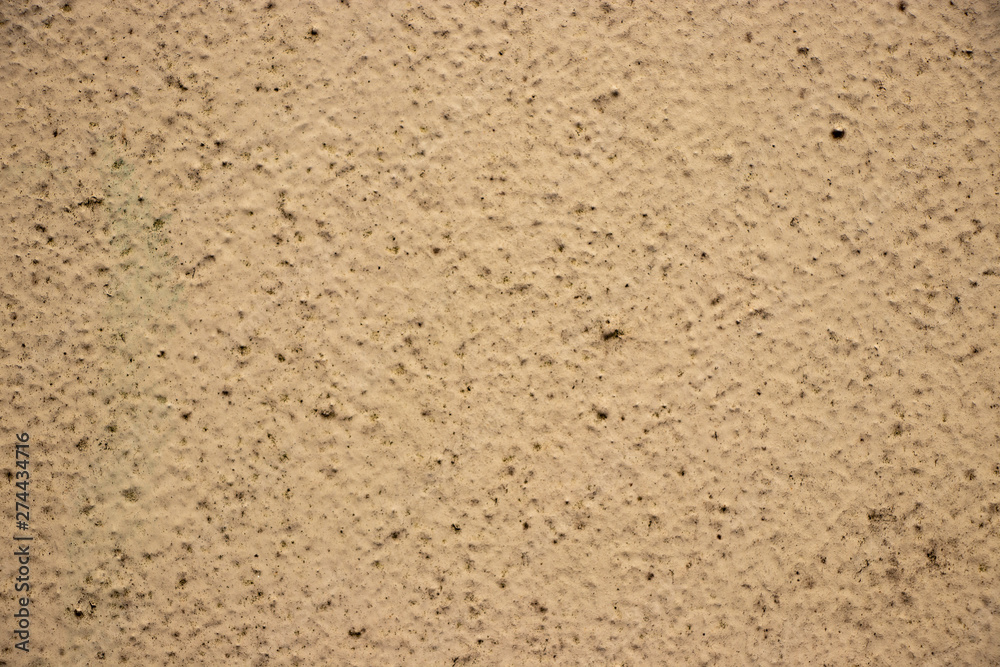Beige painted grunge wall rough texture Beige painted grunge wall rough texture