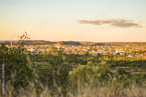 Cityscape of Oeiras viewed from the top of a hill at sunset- Piaui state, Brazil © Helissa