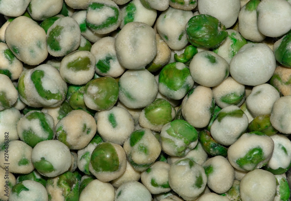 Macro image of Wasabi Peas, a hot snack of roasted peas and other ingredients including fiery Wasabi. They have fiber but a fairly high calorie count. Macro image of Wasabi Peas, a hot snack of roasted peas and other ingredients including fiery Wasabi. They have fiber but a fairly high calorie count.