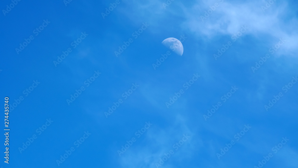 moon on a blue sky day moon on a blue sky day