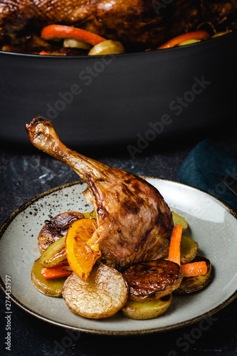 Roasted Goose Leg with Potatoes, Carrots and Oranges