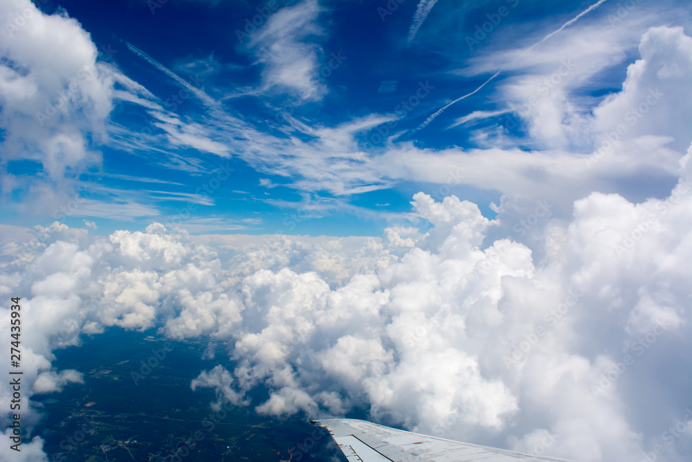 Fototapeta premium Puffy Clouds on Blue Sky Background