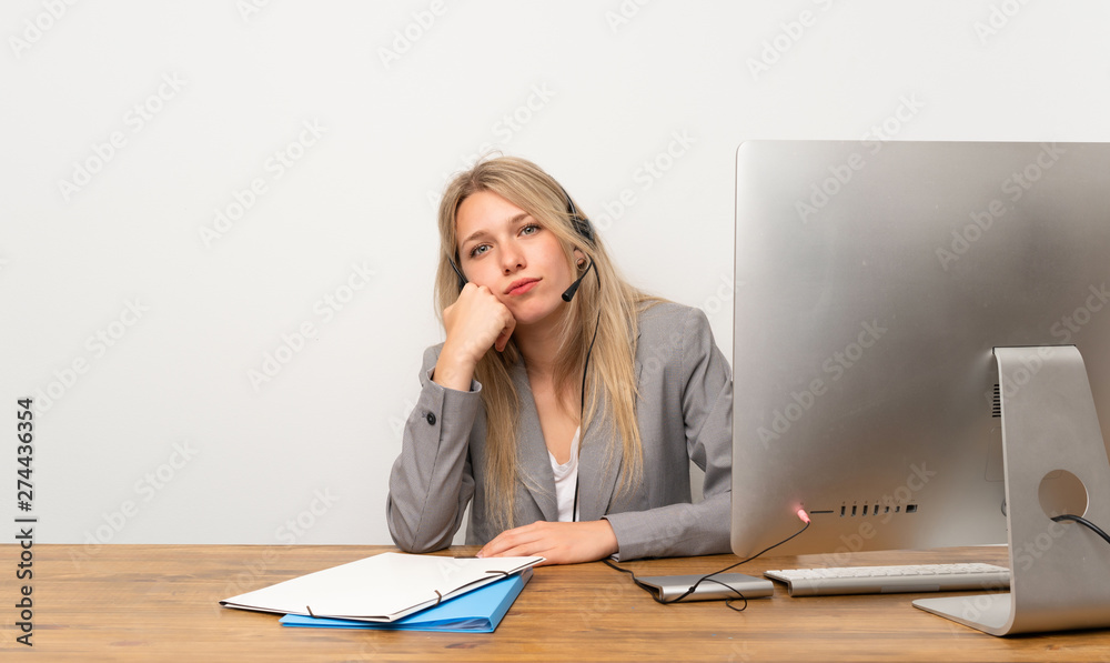 Young woman working with headset thinking an idea Young woman working with headset thinking an idea