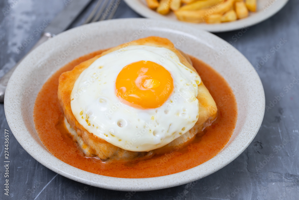 typical portuguese dish francesinha in dish on ceramic background typical portuguese dish francesinha in dish on ceramic background