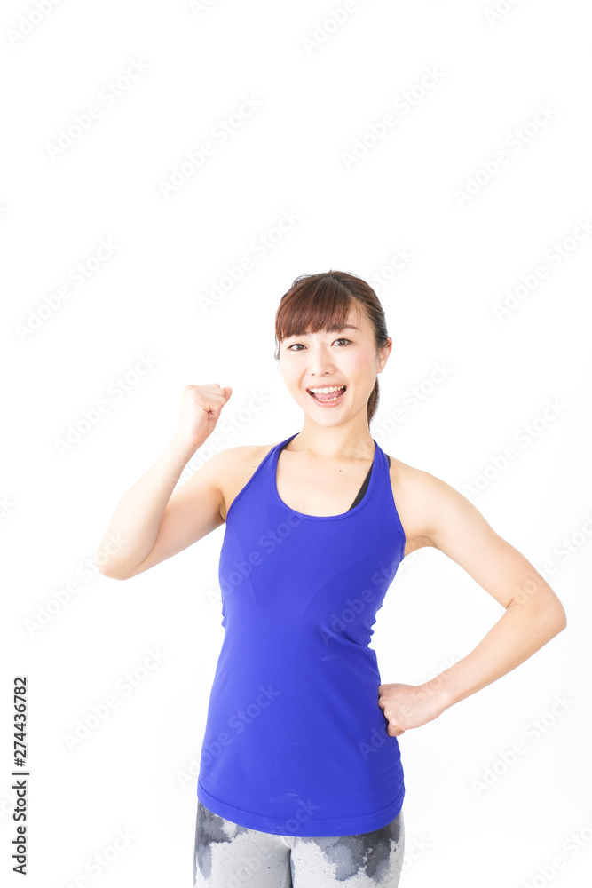 筋肉を鍛えるスポーツウェアを着た女性 筋肉を鍛えるスポーツウェアを着た女性