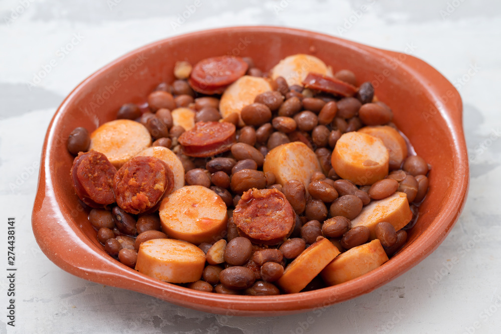 beans with smoked sausages and sausages in ceramic dish beans with smoked sausages and sausages in ceramic dish