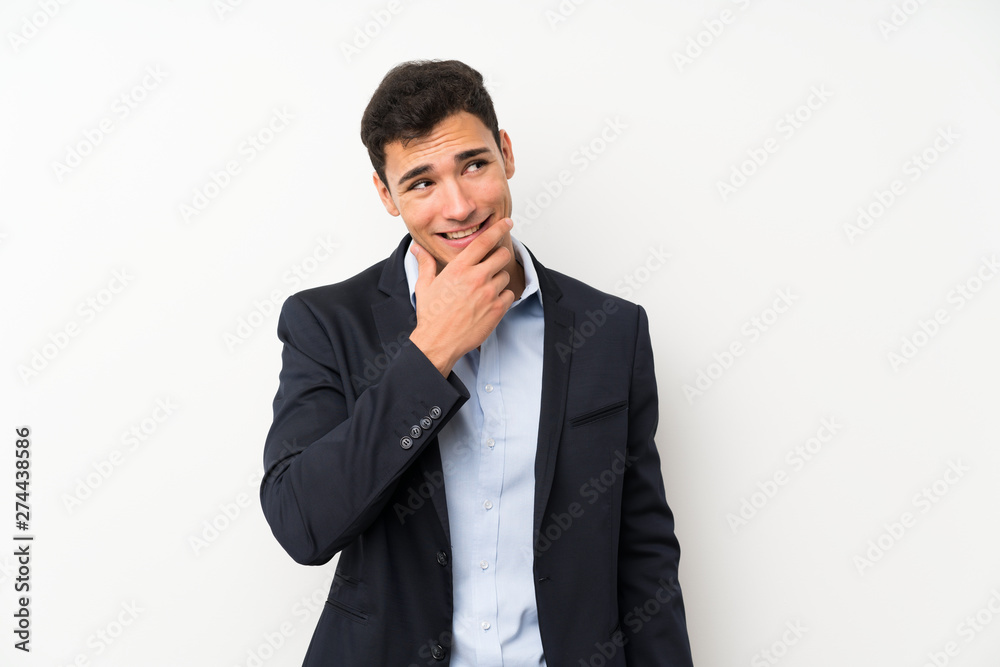 Handsome man over isolated white wall thinking an idea Handsome man over isolated white wall thinking an idea