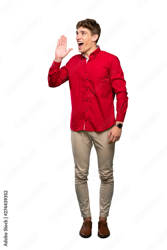 A full-length shot of a Handsome young man shouting with mouth wide open over isolated white background A full-length shot of a Handsome young man shouting with mouth wide open over isolated white background