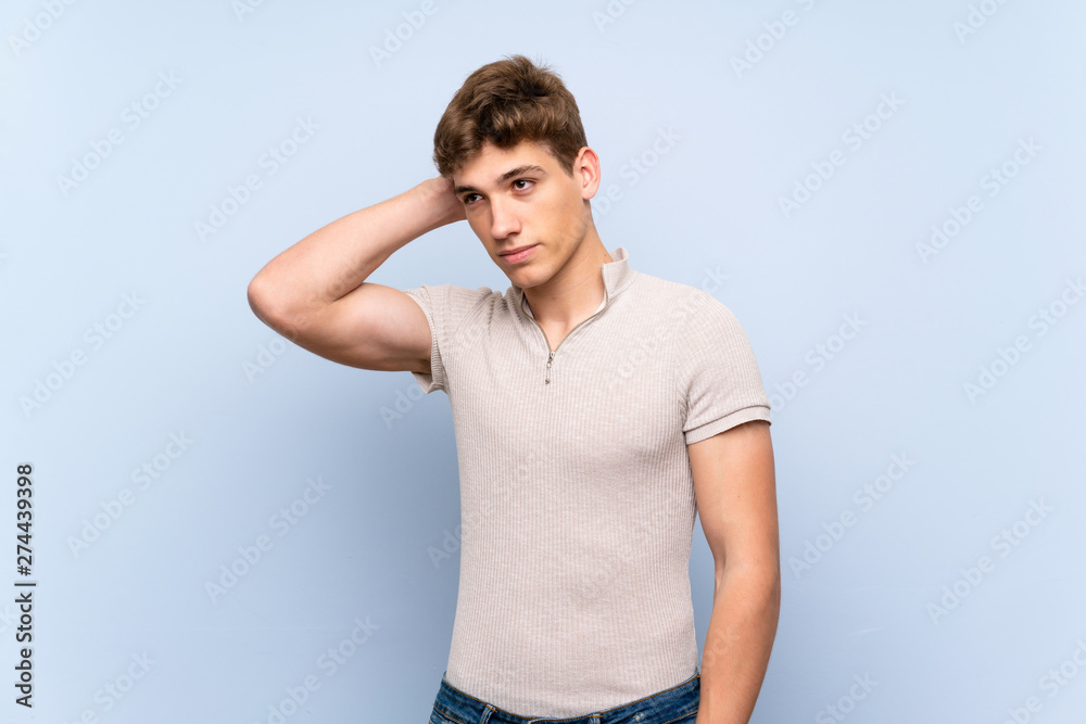 Handsome young man over isolated blue wall thinking an idea Handsome young man over isolated blue wall thinking an idea