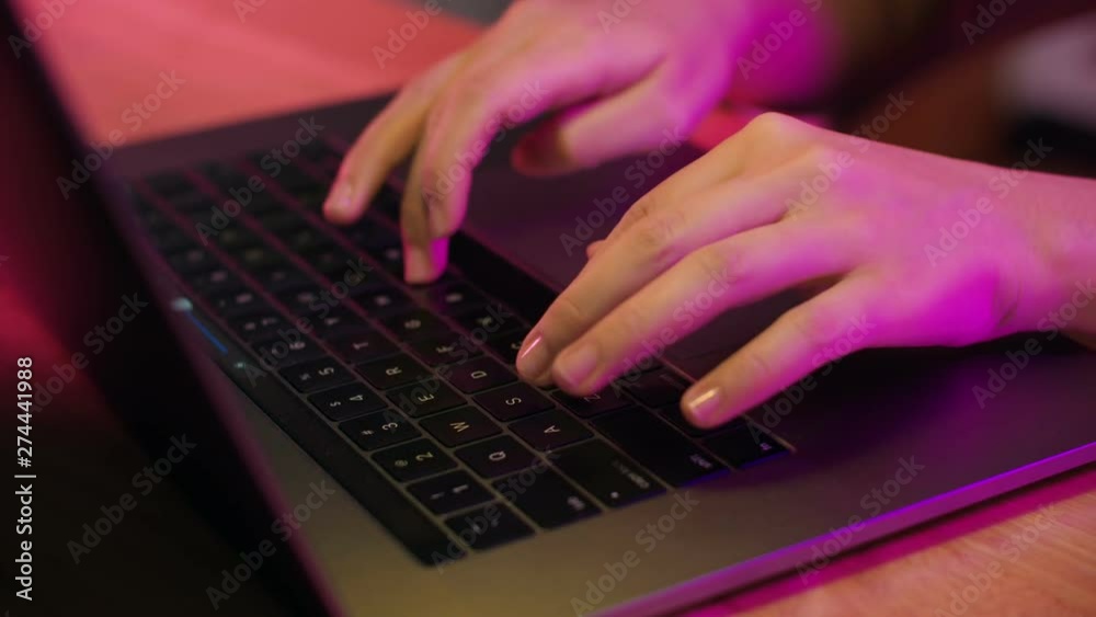 Close up of female fingers typing messages on laptop keyboard Close up of female fingers typing messages on laptop keyboard