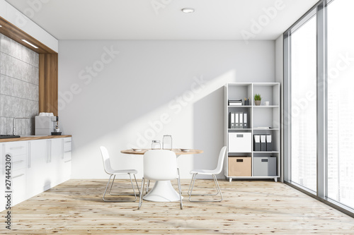 Photos White kitchen with table and bookcase
