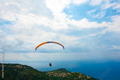 Paragliding in the sky. Extreme sport. Rachi village. Lefkada. Greece.