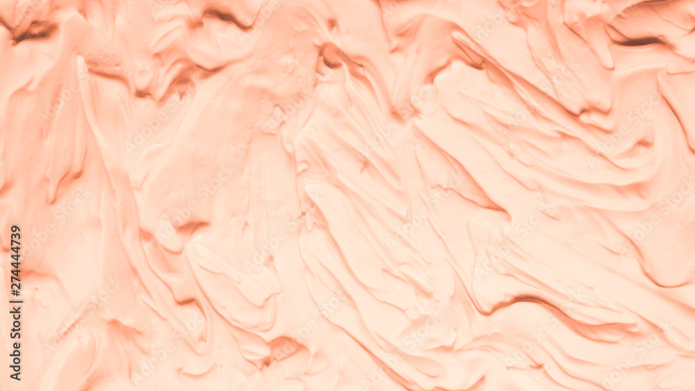 Fototapeta premium Peach foam texture abstract art background. Smeared whipped cream design surface.