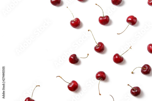 Ripe red cherries arranged on white background isolated with copy space for text