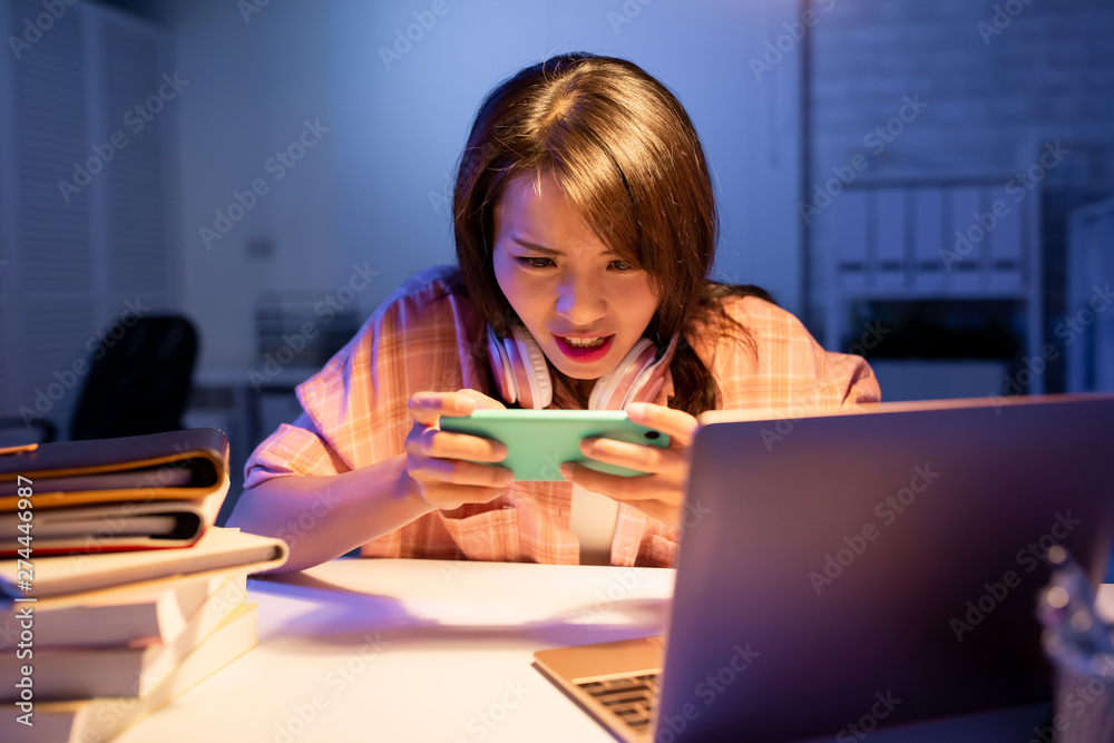 student play game on phone student play game on phone