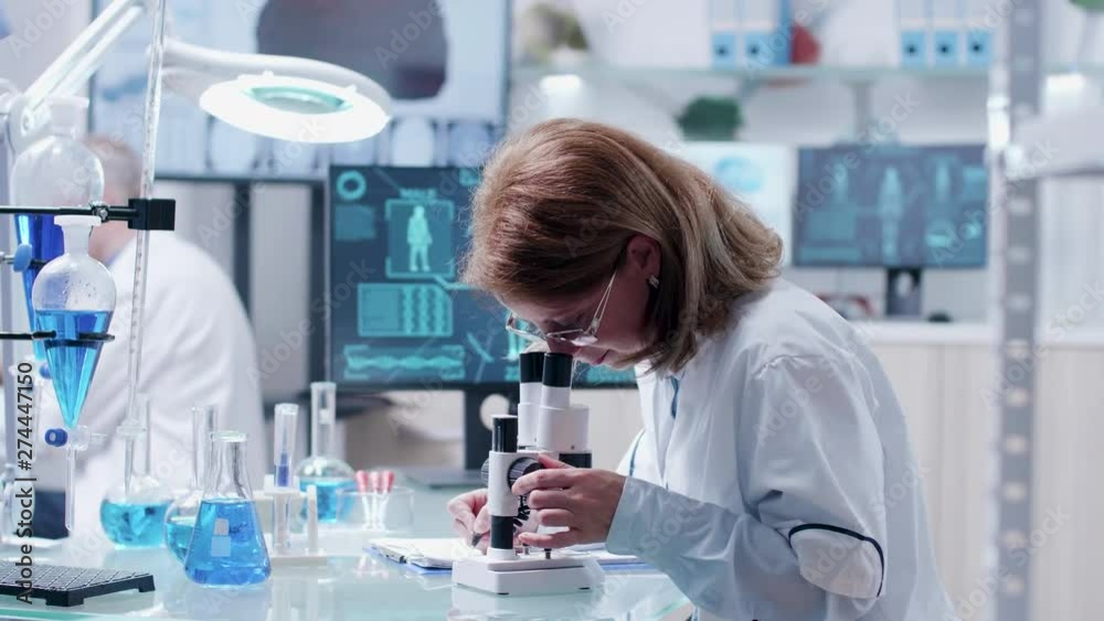 Researcher team working in modern high end laboratory