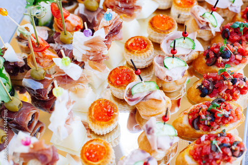 Beautifully decorated catering banquet with different food snacks and appetizers