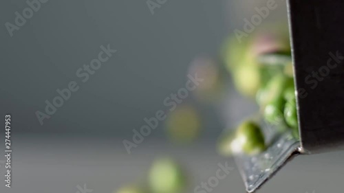 Mediterranean tradition. Extra virgin olive oil.Olive falling in the crusher photo