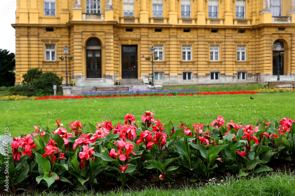 Flowers in front of historical Croatian national theatre building in Zagreb, Croatia.