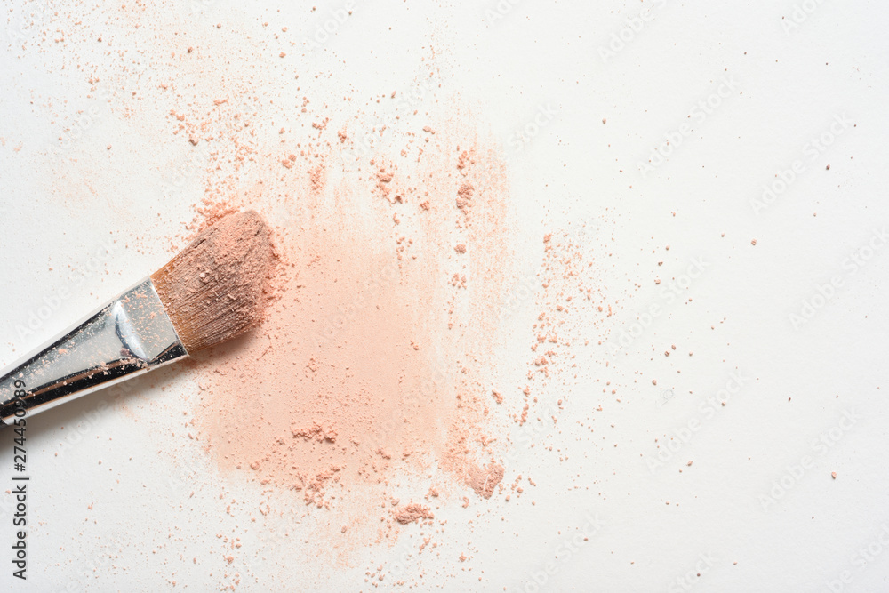Pink make up spilled over white surface with make up brush covered in powder - obrazy, fototapety, plakaty 