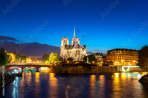 Seine river and Notre Dame de Paris at night in Paris, France.