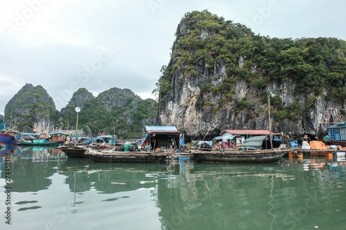 floating village at Cat Ba island Vietnam - limestone cliffs fishing boats