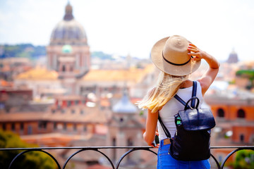 Rome Europe Italia travel summer tourism holiday vacation background -young smiling girl with mobile phone camera and map in hand standing on the hill looking on the cathedral Vatican