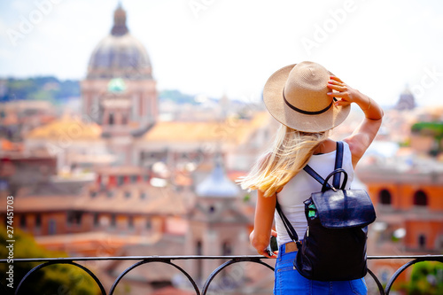 Rome Europe Italia travel summer tourism holiday vacation background -young smiling girl with mobile phone camera and map in hand standing on the hill looking on the cathedral Vatican