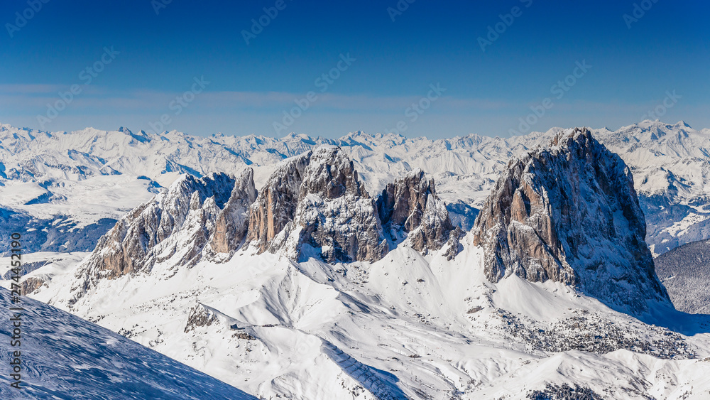 winter panorama of snowcapped Dolomites mountains, Italy