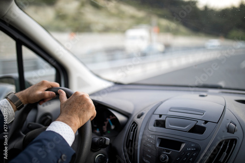 Businessman driving car