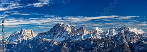 Panoramic view of snowy Dolomites mountains in Italy, Civetta ski resort and Monte Pelmo in background
