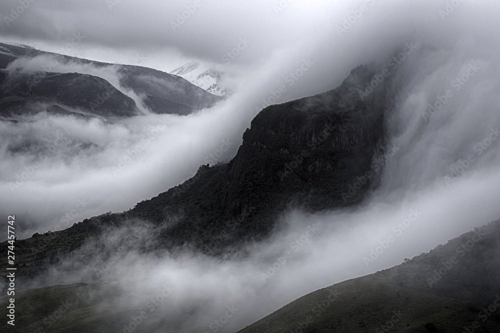 Fototapeta premium View of the foggy valley in Sierra Nevada de Santa Marta, Cordillera, Colombia dramatic scene, beautiful world,scenic view with cloudy sky, majestic impressive dawn in mountain landscape, wallpaper