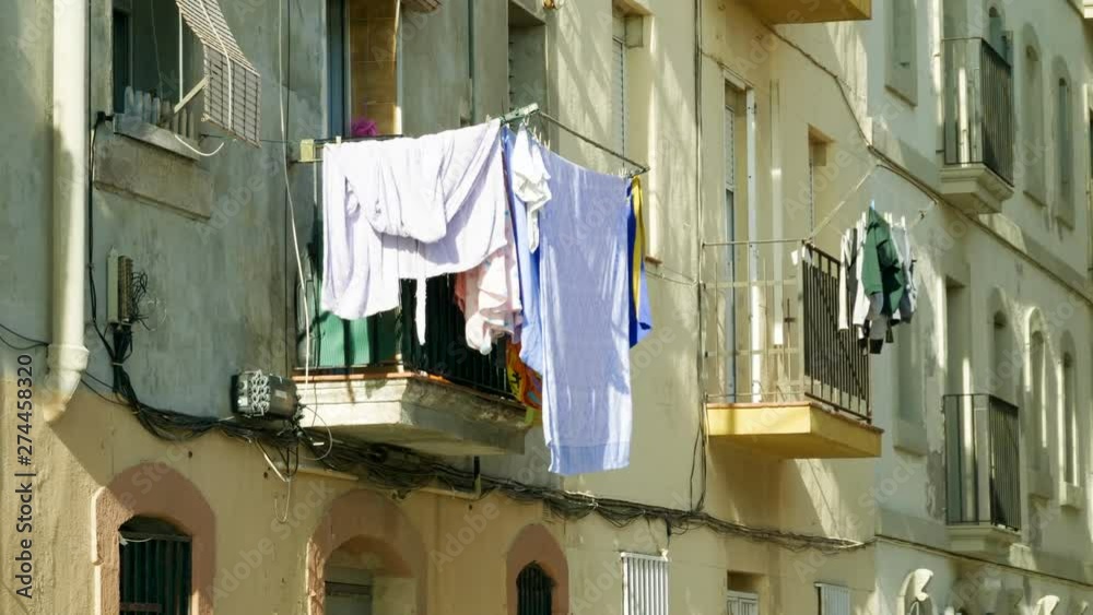 City landscape: architecture, buildings, landmarks. Clothes drying outside. Port Marina. Street view of town Barcelona. Spain. 4K