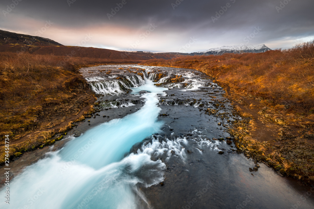 Landscape in Iceland waterfall sun mountains light golden hour road Landscape in Iceland waterfall sun mountains light golden hour road