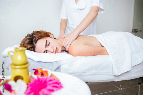 attractive woman getting a relaxing massage at a home spa