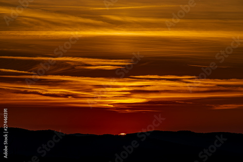 Red and orange sunset sky near Ceske Budejovice city in spring evening