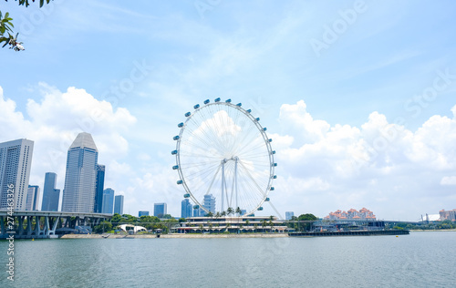 Singapore flyer, ferris wheel in sunny day, Singapore tourist attraction © Igor Luschay