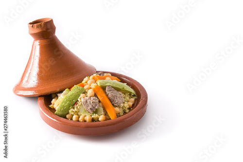 Traditional tajine with vegetables, chickpeas, meat and couscous isolated on white background. Copyspace photo