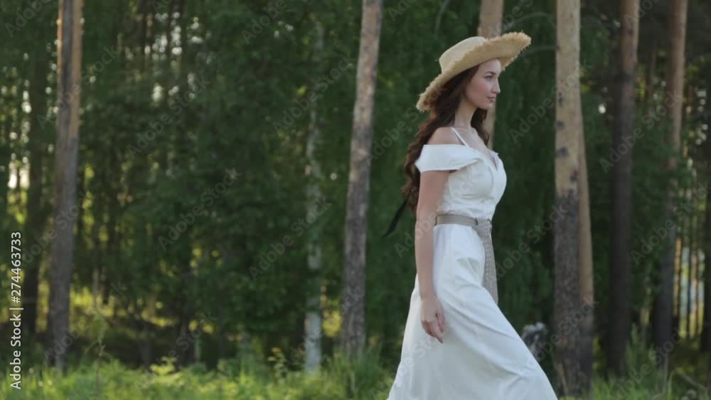 Summer walks in the Park. Cute romantic girl walking in the woods. Summer walks in the Park. Cute romantic girl walking in the woods.