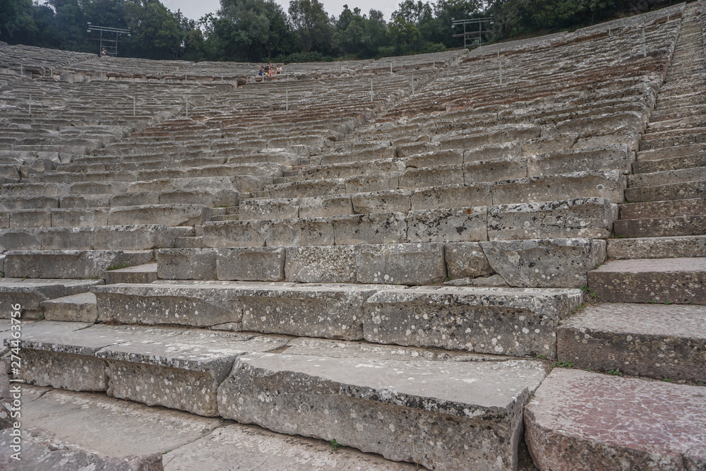 Epidaurus, Greece: Close-up of the seats at the ancient theater of Epidaurus, designed by Polykleitos the Younger in the 4th century BC. Epidaurus, Greece: Close-up of the seats at the ancient theater of Epidaurus, designed by Polykleitos the Younger in the 4th century BC.