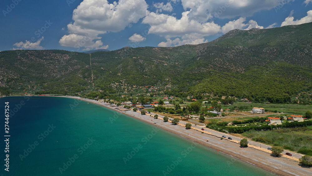 Aerial panoramic photo of famous sandy beach of Psatha in West Attica with emerald clear sea, Corinthian gulf, Greece