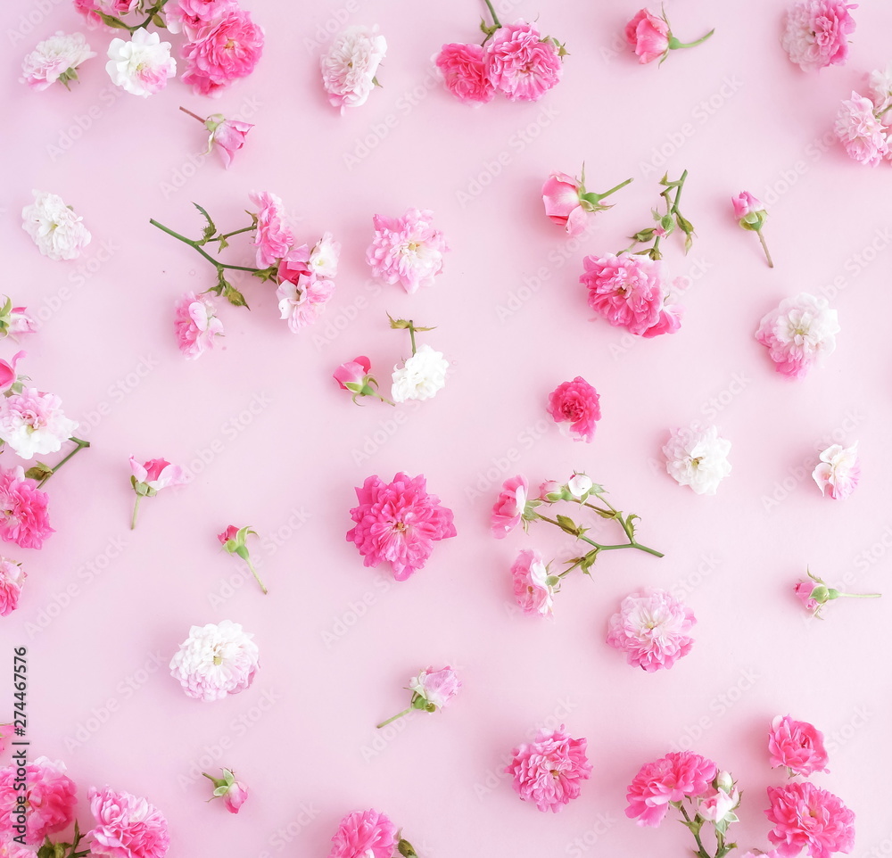 Flowers composition. Pattern made of pink roses flowers on pink background. Flat lay, top view. Flowers composition. Pattern made of pink roses flowers on pink background. Flat lay, top view.