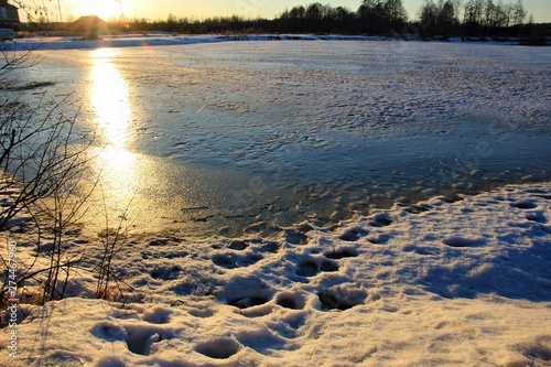 Spring on a frozen lake on a Sunny day. Russia. Semenov photo