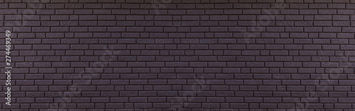 Texture of panoramic black brick wall, brickwork background for design or backdrop