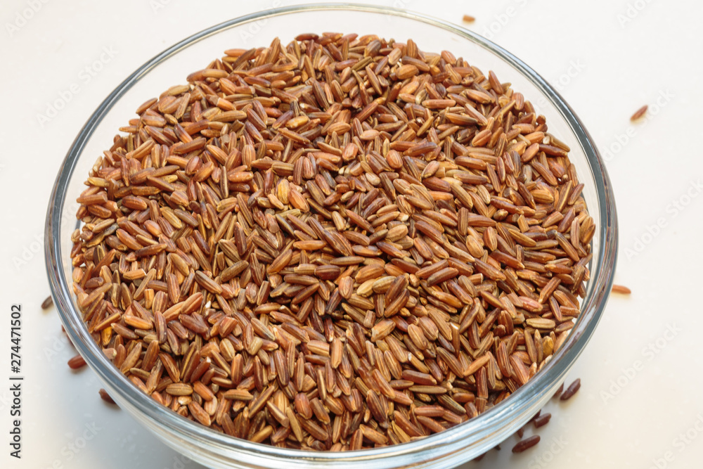 Brown rice grains isolated on white background. Brown rice grains isolated on white background.