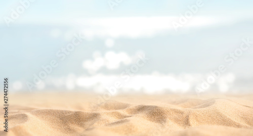 Summer tropical sand beach and bokeh sun light on sea background, copy space. © oatawa